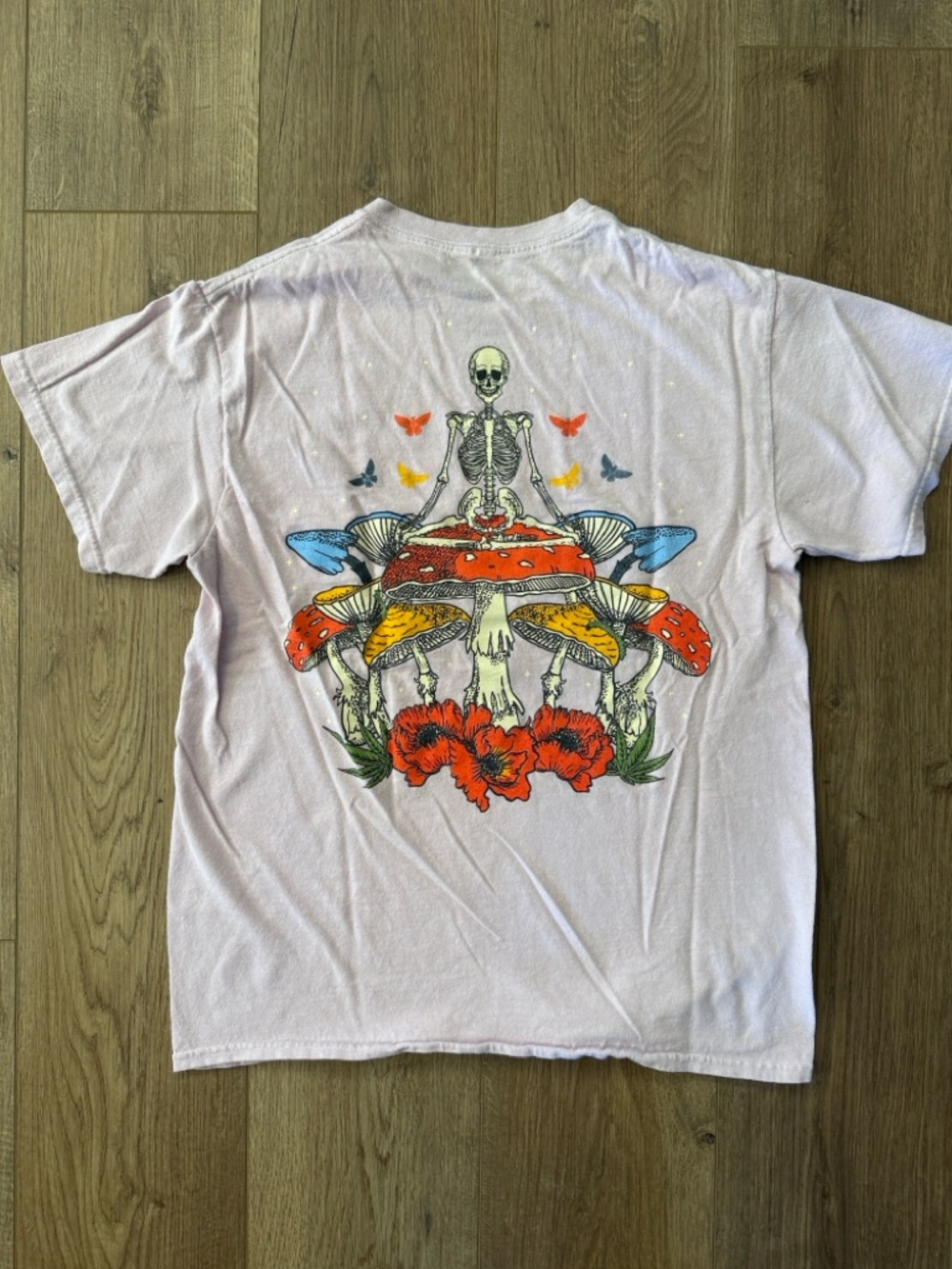 Light Pink Short Sleeve Graphic Tee with fun mushroom, skeleton design. Size M